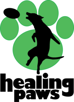 Healing Paws logo - black silhouette of a dog catching a frisbee placed over a green paw print